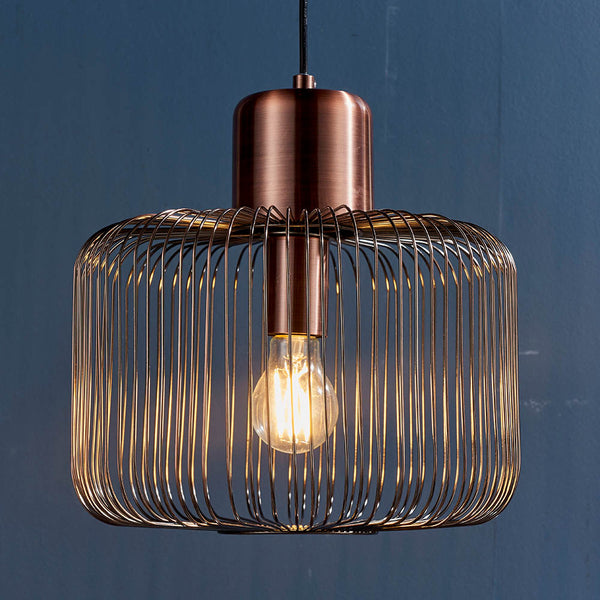 Nicola Cage Pendant lit up in a styled kitchen