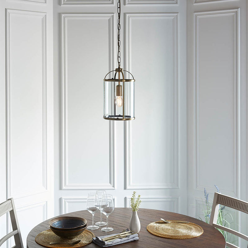 Lambeth Lantern Pendant lit up in a styled hallway