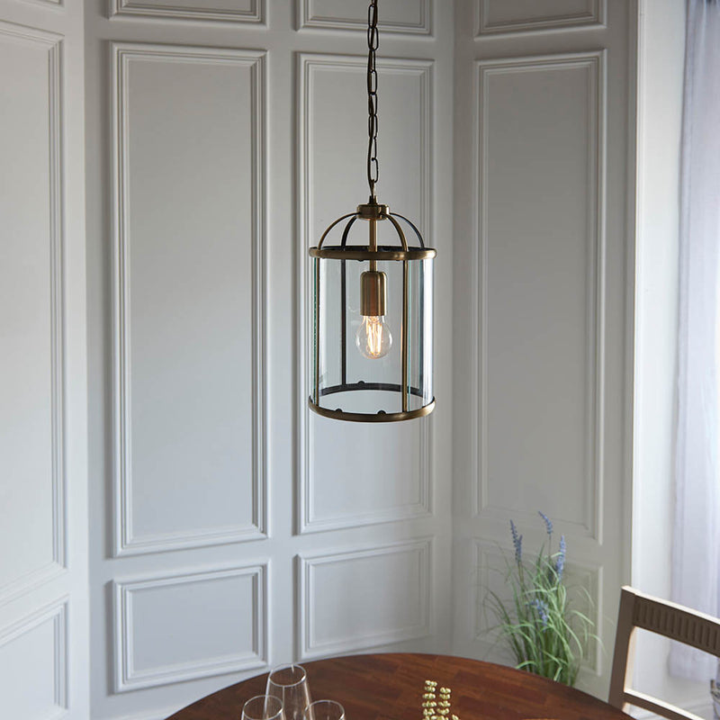 Lambeth Lantern Pendant in antique brass shown in a room setting