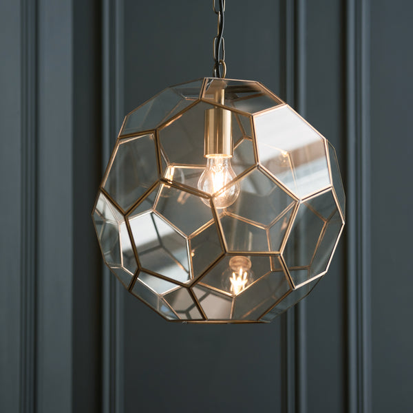 Miele Pendant in antique brass shown in a room setting