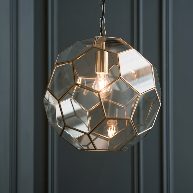 Miele Pendant in antique brass shown in a room setting