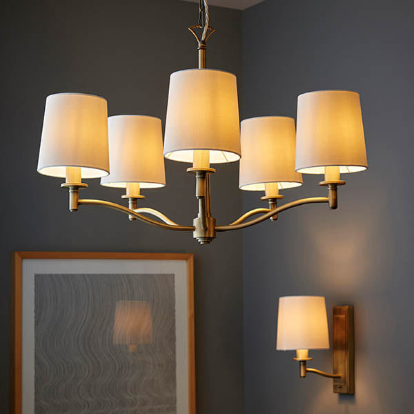 Ortona 5 Light Chandelier lit up in a styled living room