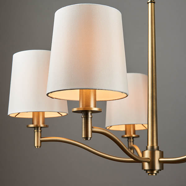 Ortona 5 Light Chandelier in matt antique brass shown in a room setting
