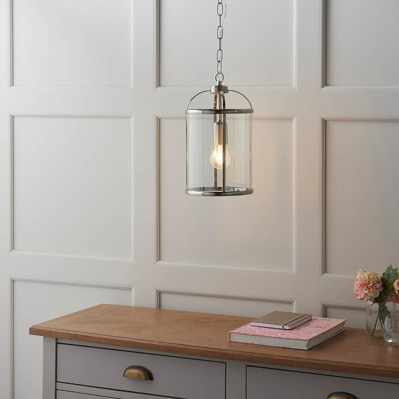 Lambeth Lantern Pendant lit up in a styled hallway