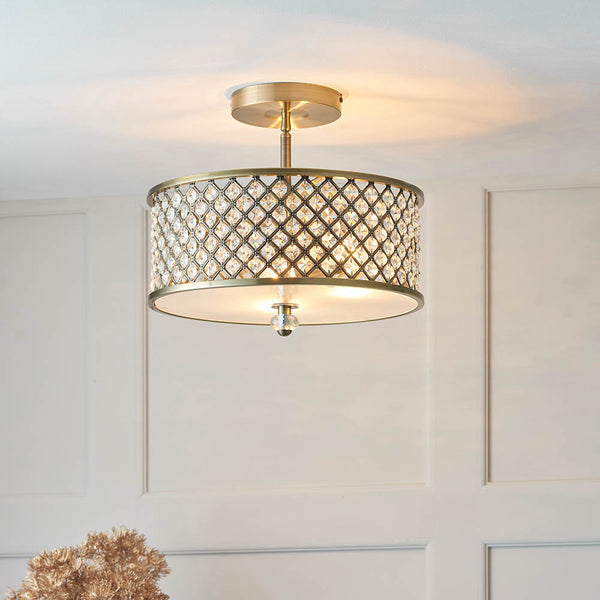 Hudson 3 Light Crystal Flush Ceiling Light lit up in a styled bedroom