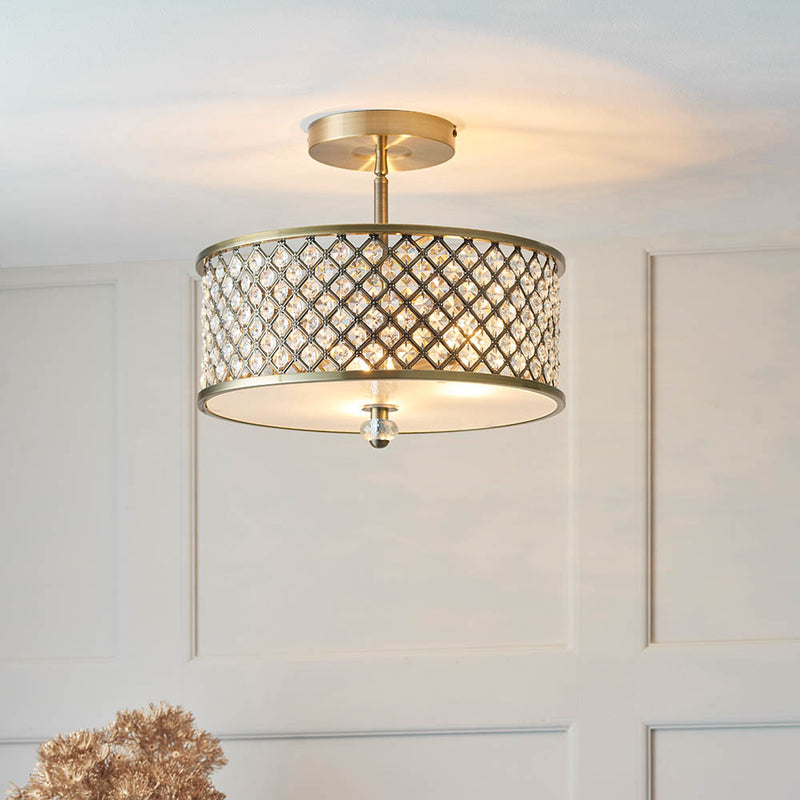Hudson 3 Light Crystal Flush Ceiling Light lit up in a styled bedroom