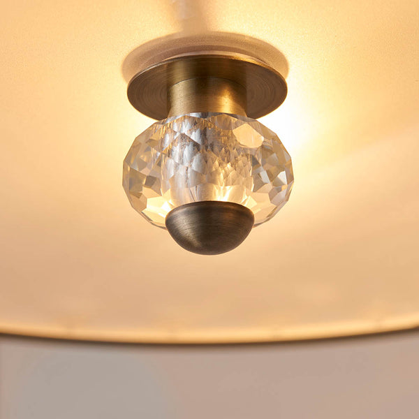 Hudson 3 Light Crystal Flush Ceiling Light in antique brass shown in a room setting