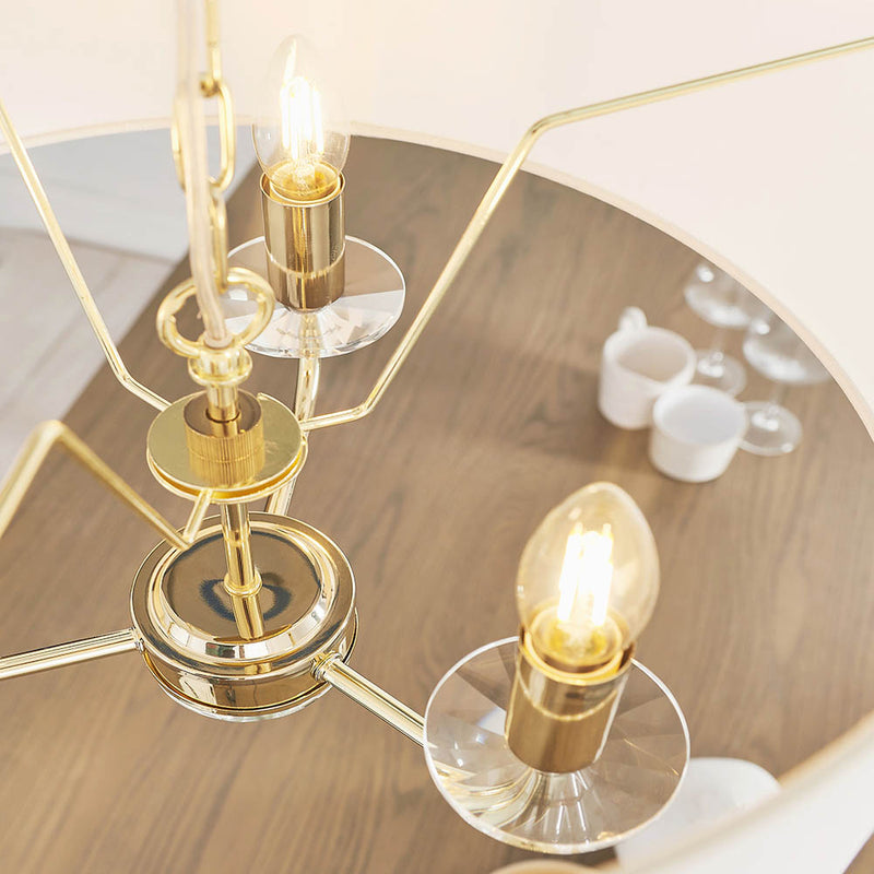 Nixon 3 Light Chandelier in brass shown in a room setting