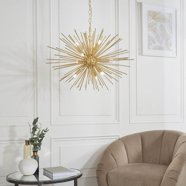 Orta 9 Light Sputnik Pendant in satin brass hanging in a living room