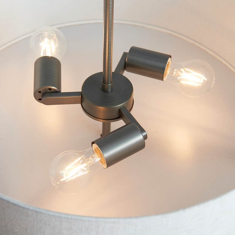 Hayfield 3 Light Drum Pendant in brushed bronze and linen shown in a room setting