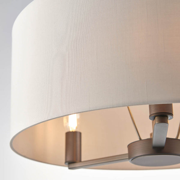 Daley 3 Light Drum Pendant in dark antique bronze shown in a room setting