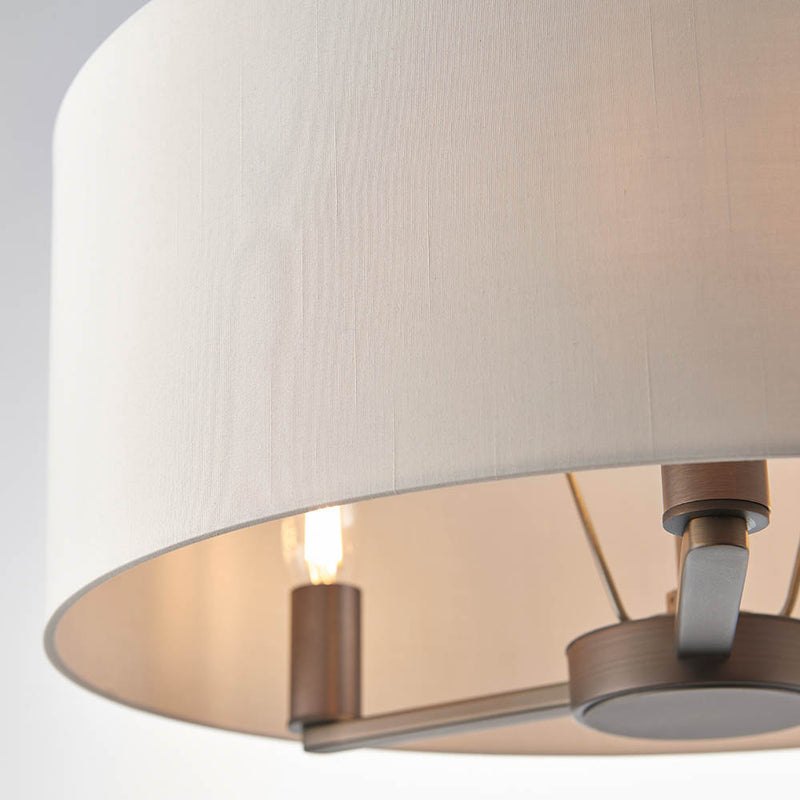 Daley 3 Light Drum Pendant in dark antique bronze shown in a room setting