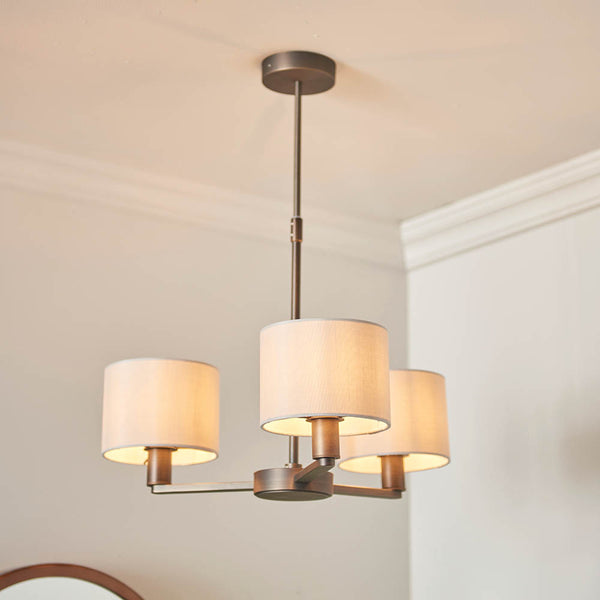 Daley 3 Light Pendant in dark antique bronze hanging in a dining room