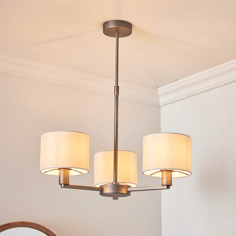 Daley 3 Light Pendant lit up in a styled dining room