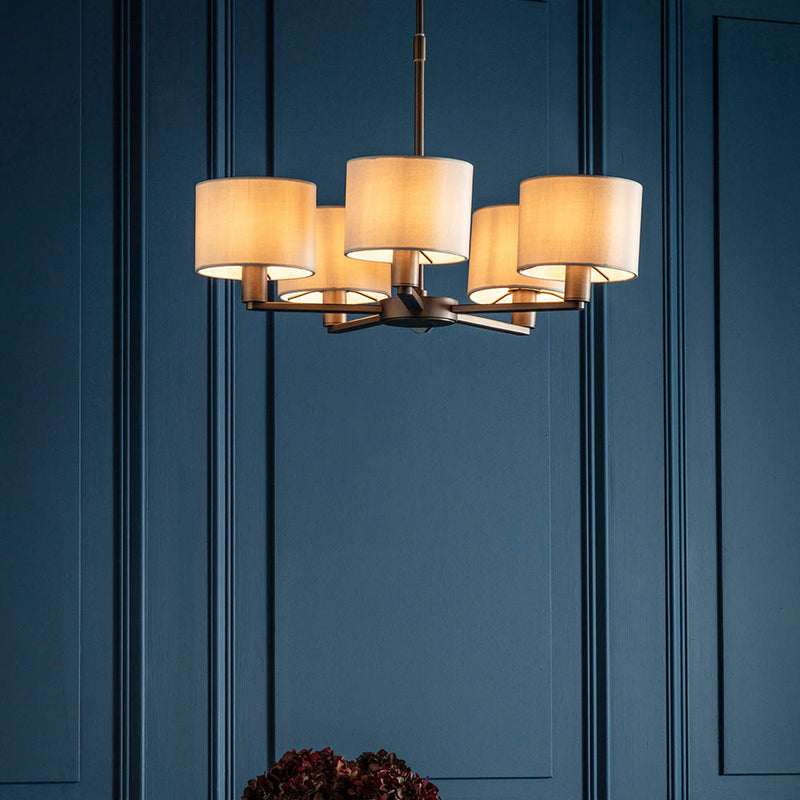 Daley 5 Light Pendant in dark antique bronze hanging in a living room