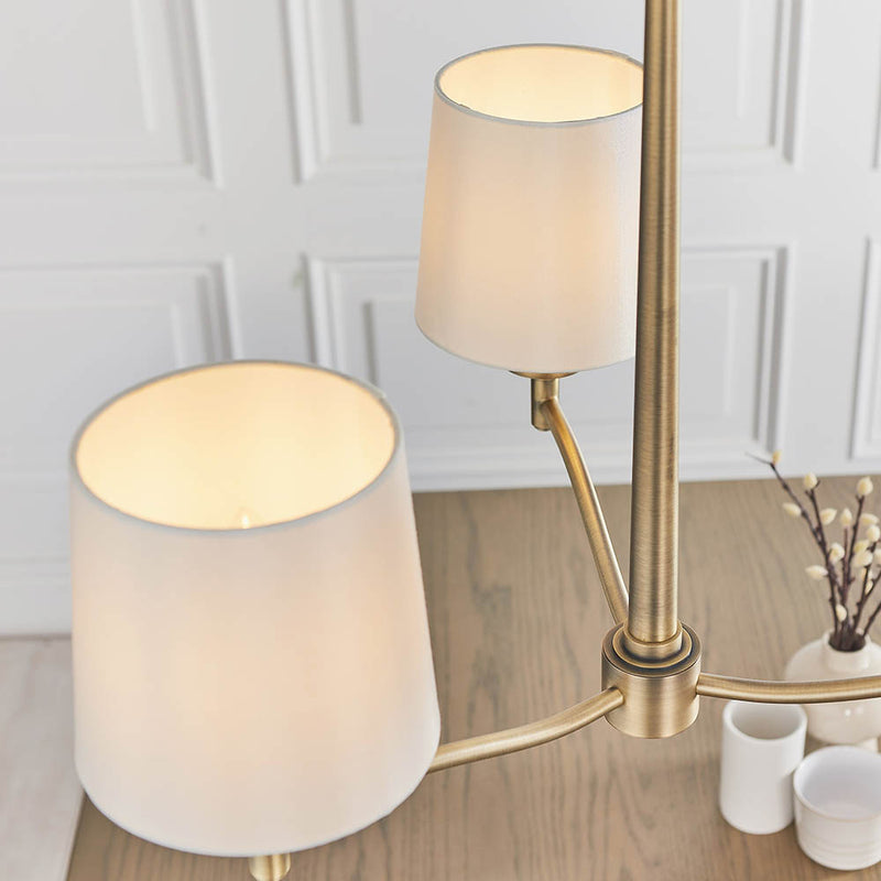 Ortona 3 Light Chandelier lit up in a styled bedroom