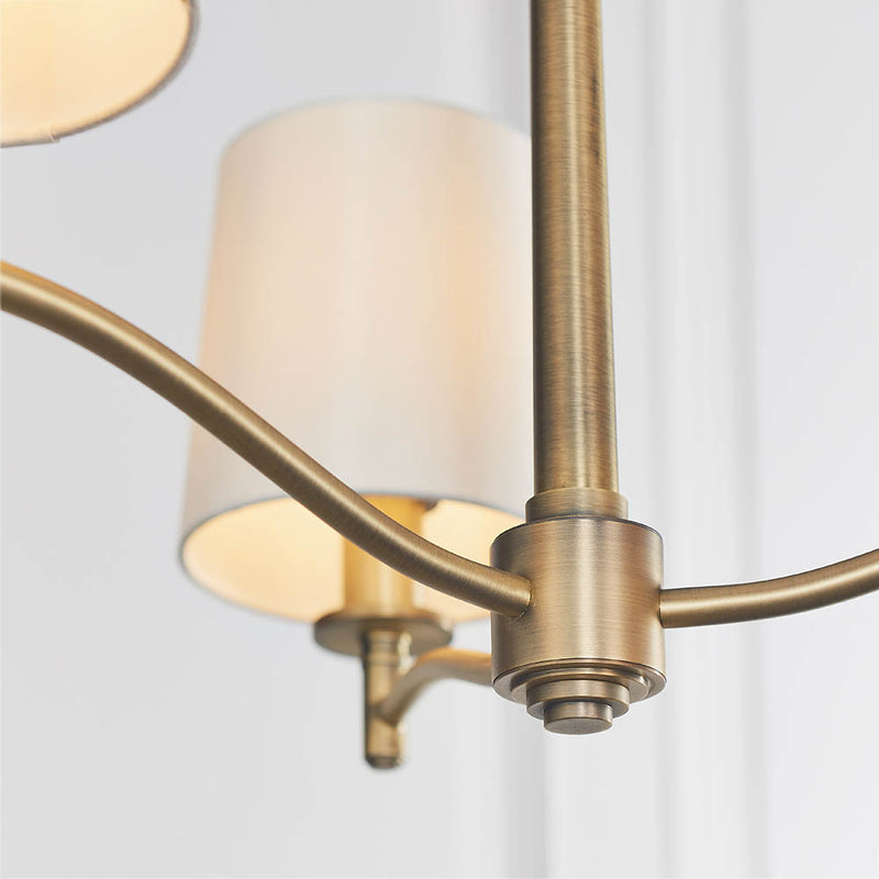 Ortona 3 Light Chandelier in matt antique brass shown in a room setting