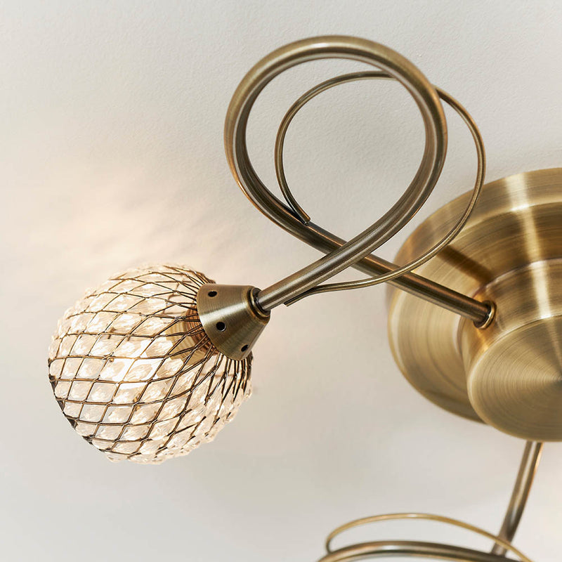 Detail of the antique brass finish on the Aherne 3 Light Flush Ceiling Light