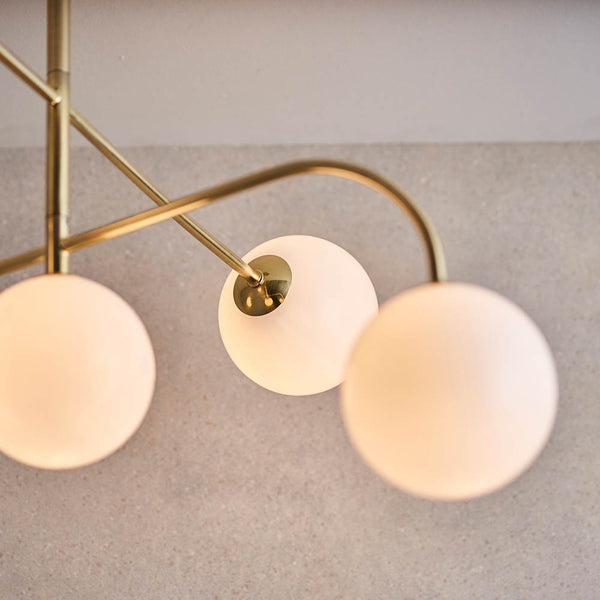 Otto 5 Light Semi Flush Ceiling Light in satin brass shown in a room setting