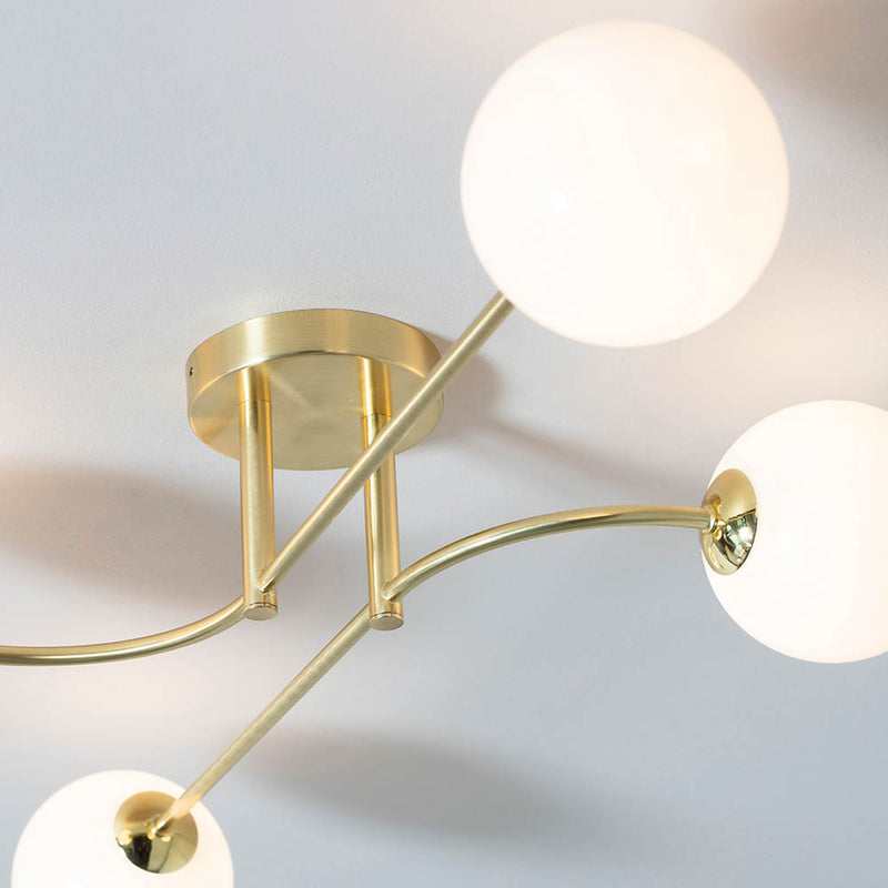Otto 4 Light Semi Flush Ceiling Light in satin brass shown in a room setting