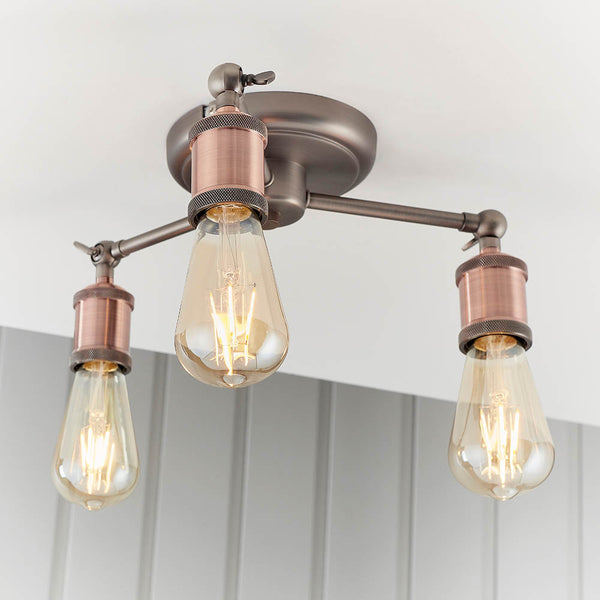 Hal 3 Light Semi Flush Ceiling Light in aged pewter and copper shown in a room setting