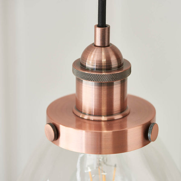 Hansen Pendant in aged copper shown in a room setting