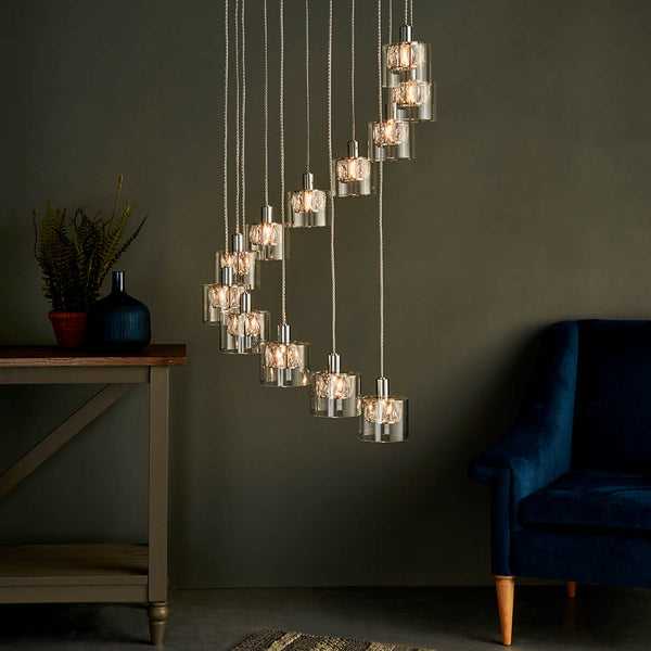 Verina 12 Light Cascade Pendant in chrome hanging in a stairwell