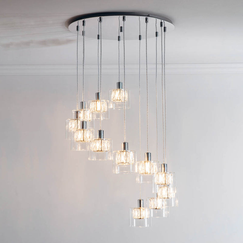 Verina 12 Light Cascade Pendant lit up in a styled stairwell