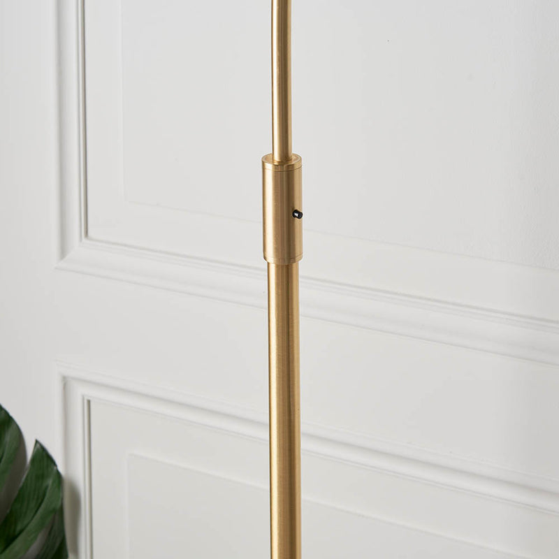 Detail of the satin brass and white marble finish on the Otto Floor Lamp