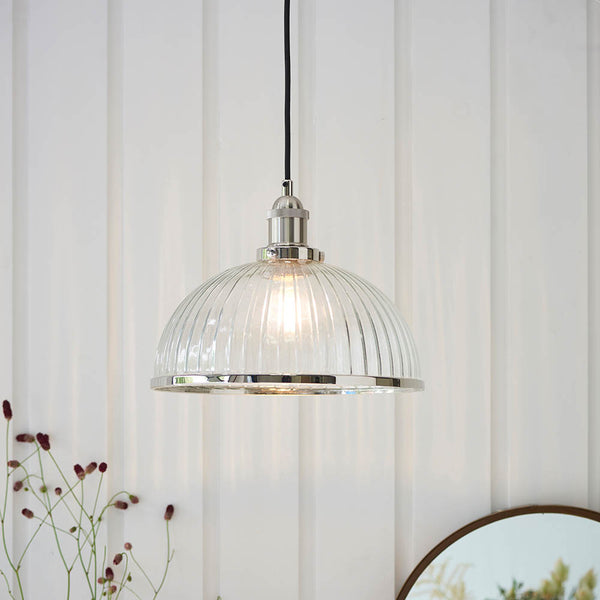 Hansen Ribbed Pendant in bright nickel hanging in a kitchen