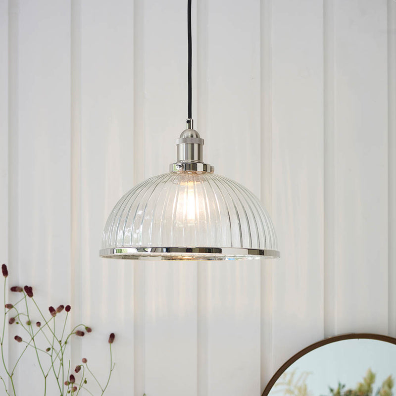 Hansen Ribbed Pendant in bright nickel hanging in a kitchen