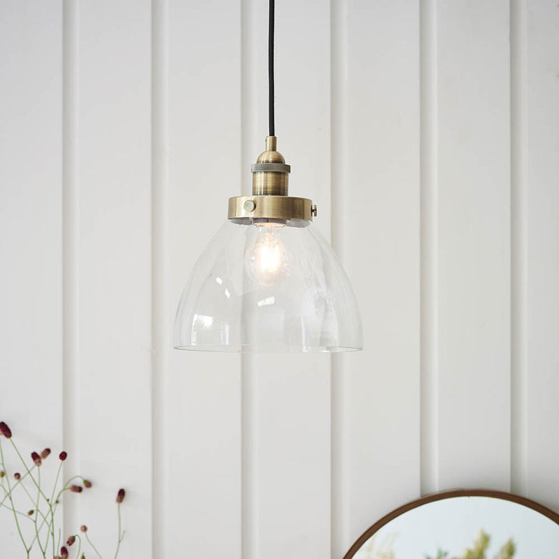 Hansen Pendant in antique brass hanging in a kitchen