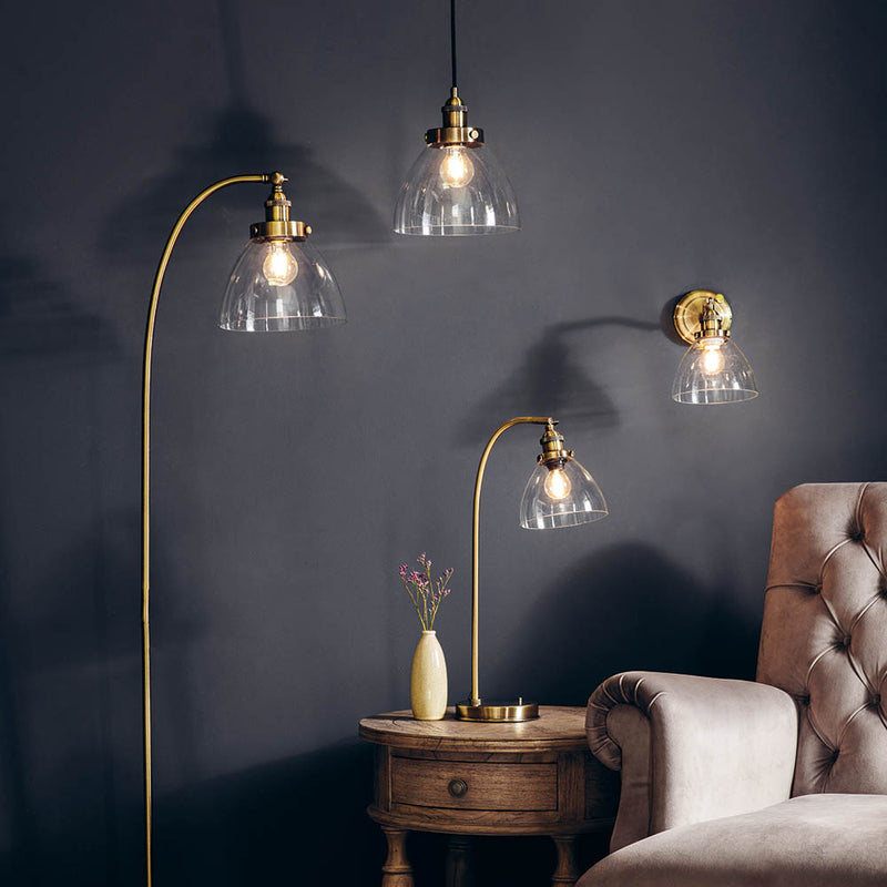 Hansen Task Table Lamp lit up in a bedroom setting