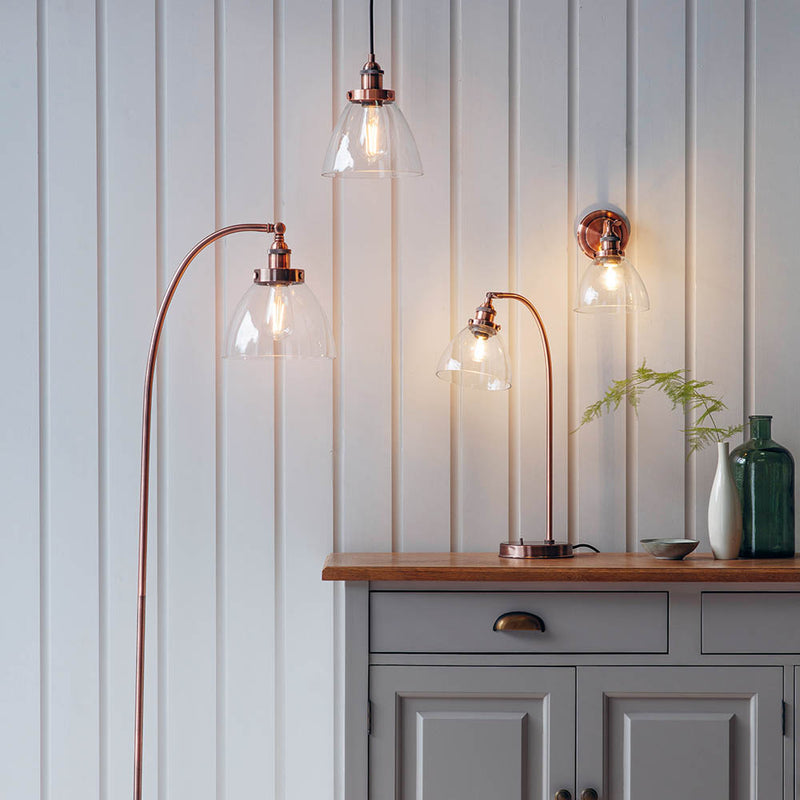 Hansen Task Table Lamp lit up in a bedroom setting
