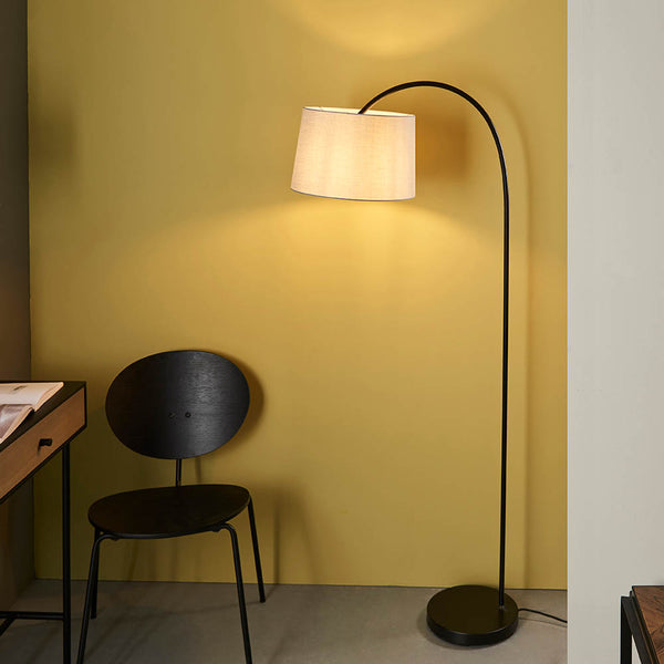 Carlson Floor Lamp lit up in a living room setting