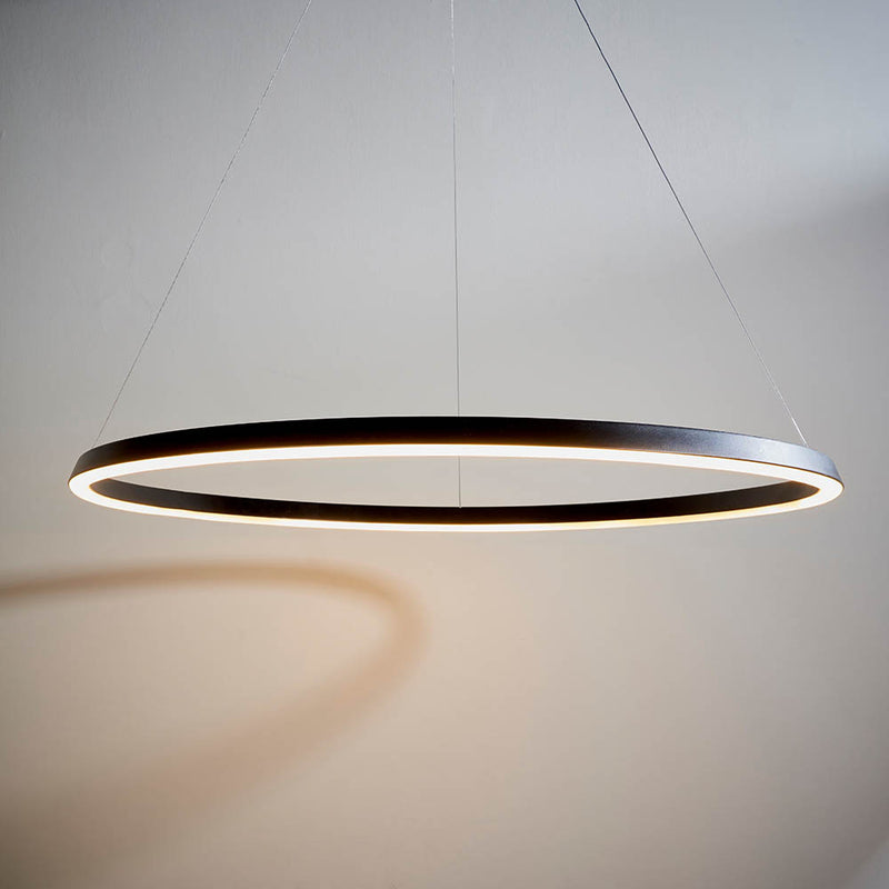 Staten LED Hoop Pendant in matt black hanging in a living room