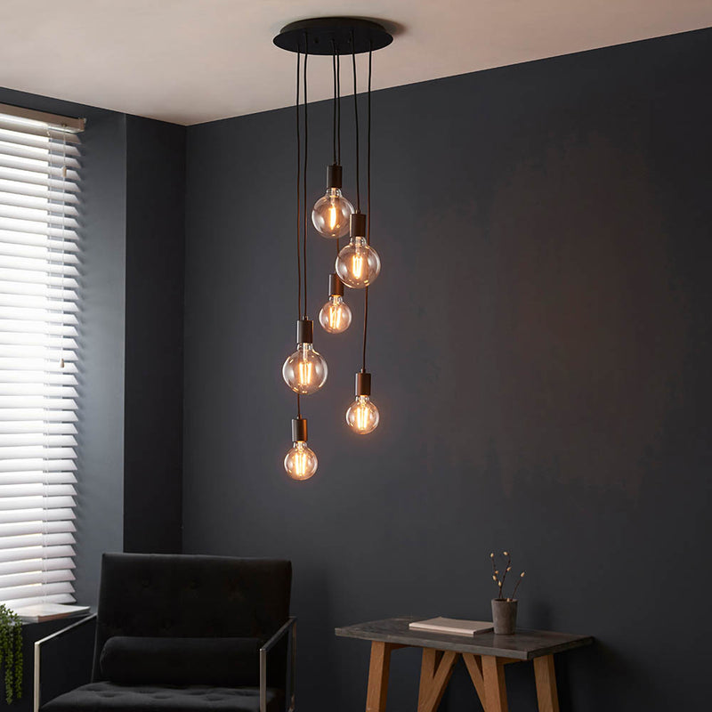 Studio 6 Light Cluster Pendant in matt black shown in a room setting