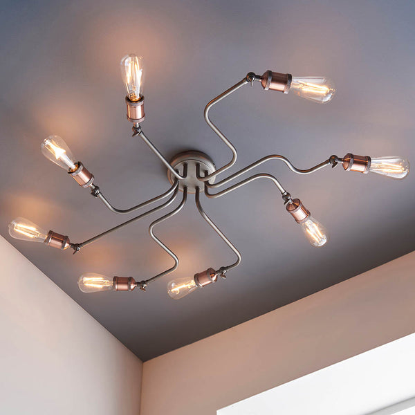Hal 8 Light Semi Flush Ceiling Light in aged copper and pewter shown in a room setting