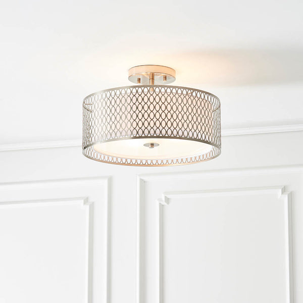 Cordero 3 Light Flush Ceiling Light lit up in a styled bedroom