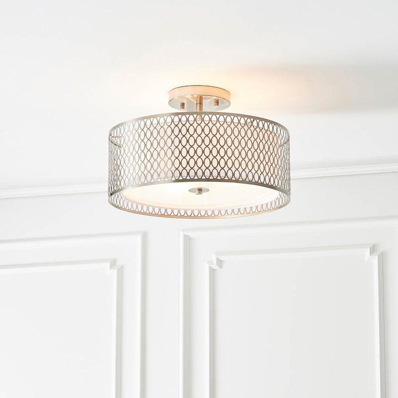 Cordero 3 Light Flush Ceiling Light lit up in a styled bedroom