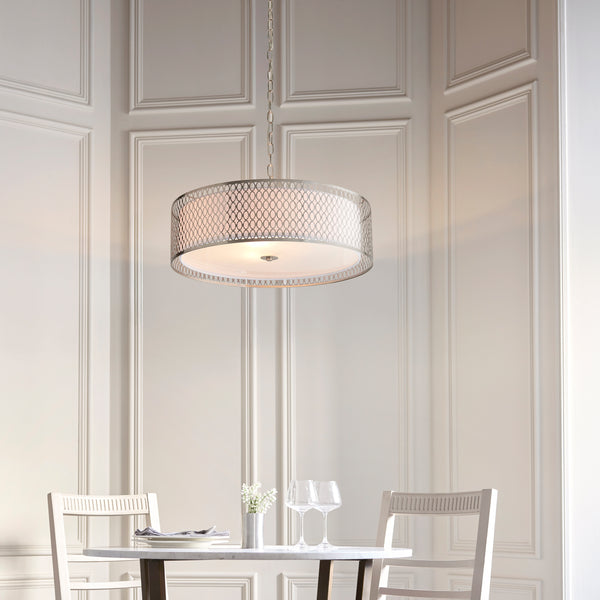Cordero 3 Light Pendant in satin nickel fretwork hanging in a living room