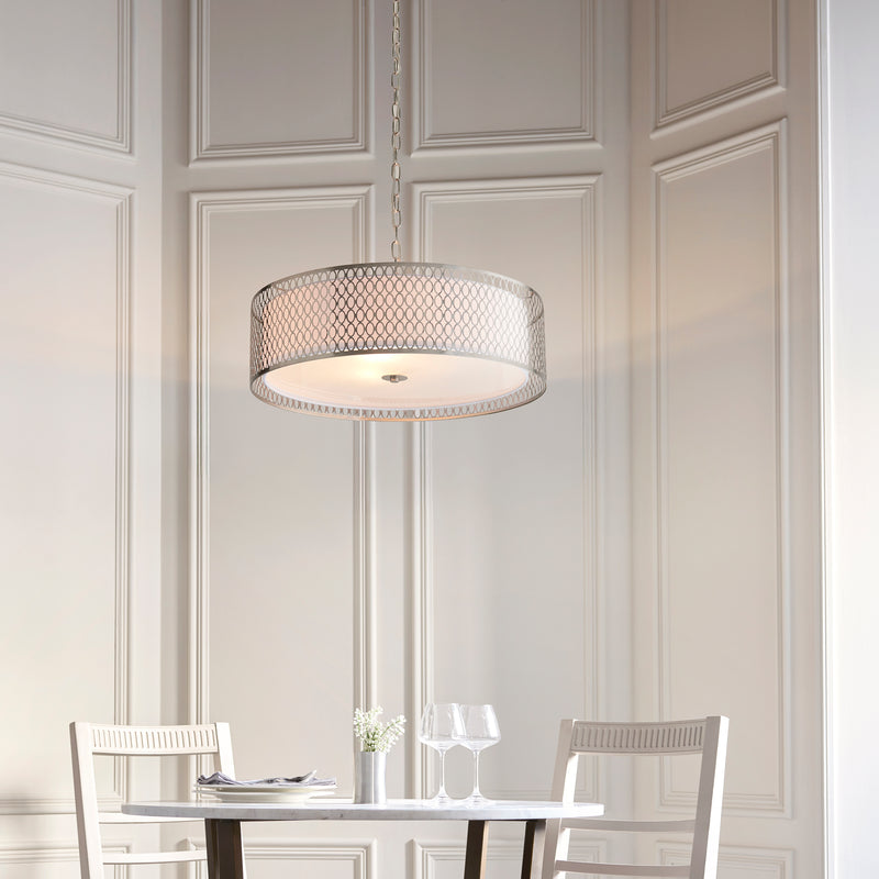 Cordero 3 Light Pendant in satin nickel fretwork hanging in a living room