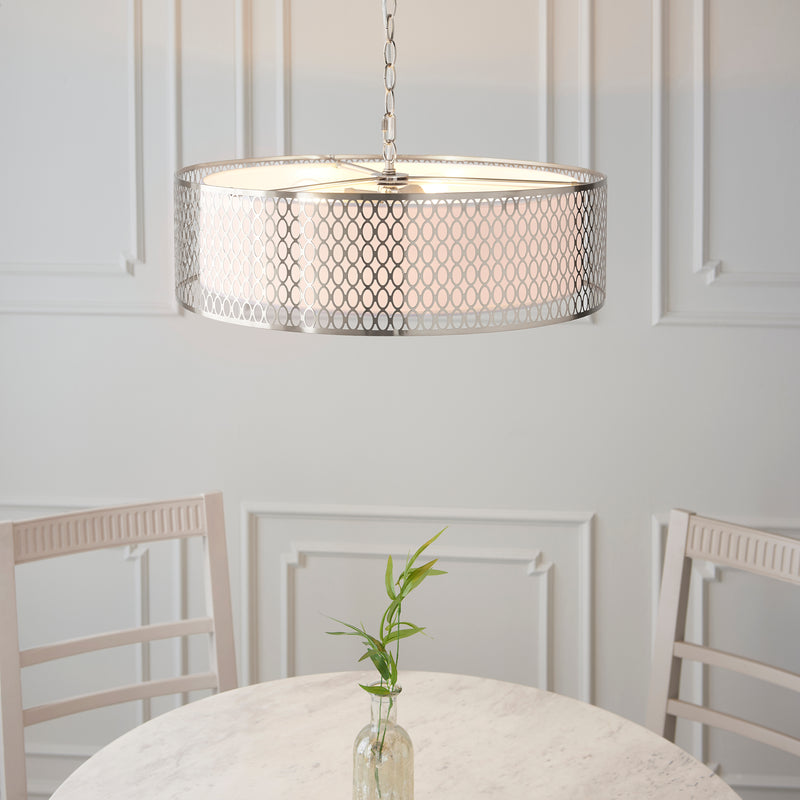 Cordero 3 Light Pendant in satin nickel fretwork shown in a room setting