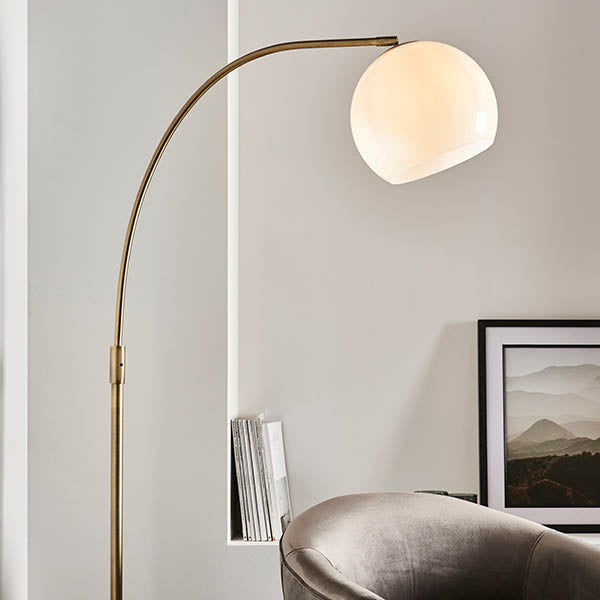 Endon Otto Floor Lamp in antique brass and black marble in a styled living room