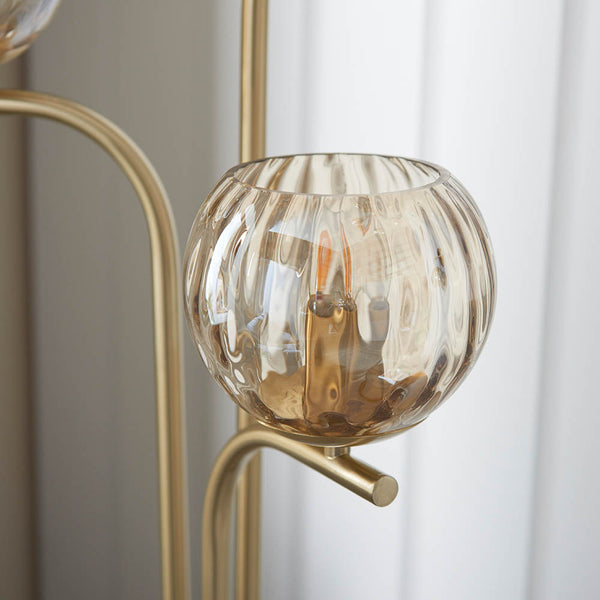 Close-up of the Dimple 3 Light Floor Lamp shade and finish