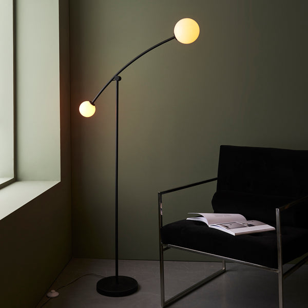 Endon Balance 2 Light Floor Lamp in matt black and opal glass in a styled living room
