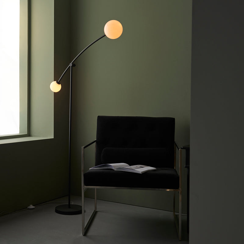 Balance 2 Light Floor Lamp lit up in a living room setting