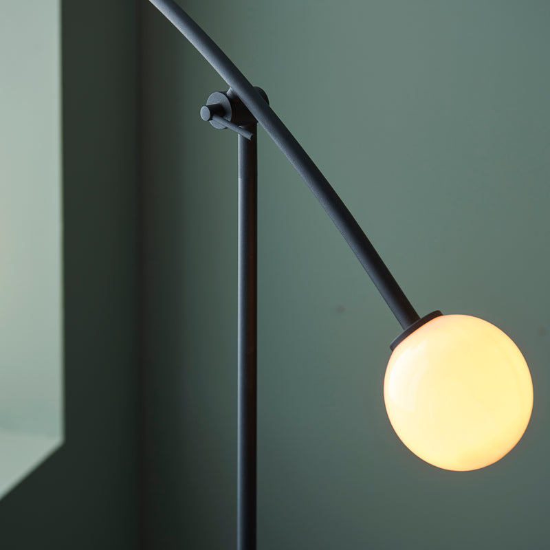 Detail of the matt black and opal glass finish on the Balance 2 Light Floor Lamp