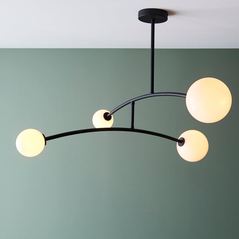 Balance 4 Light Semi Flush Ceiling Light in matt black and opal glass on a living room ceiling
