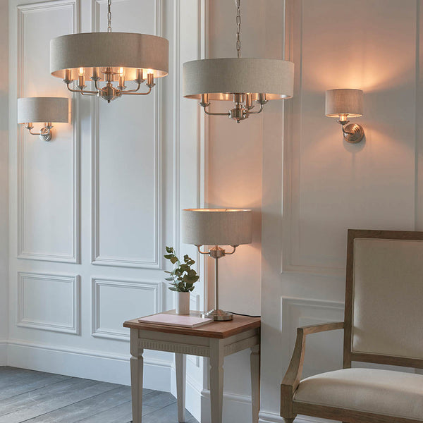 Highclere 3 Light Table Lamp lit up in a living room setting